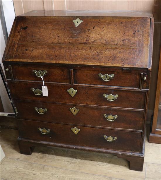 A George III oak bureau W.94cm